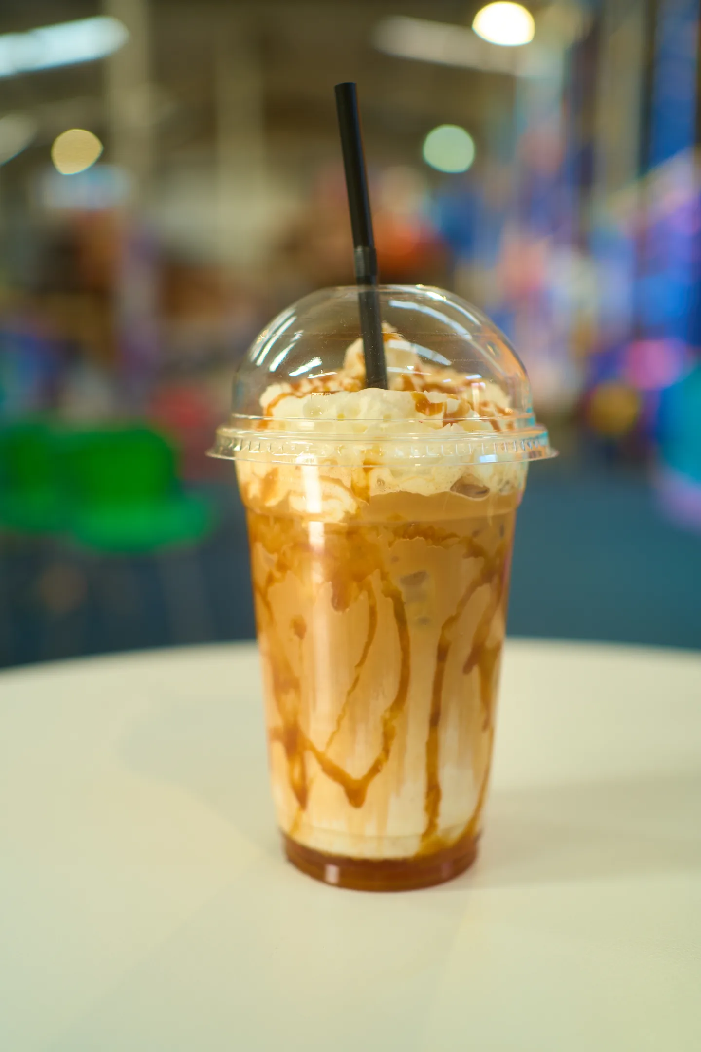 Iced coffee in a clear takeaway cup at Pirates Adventure café