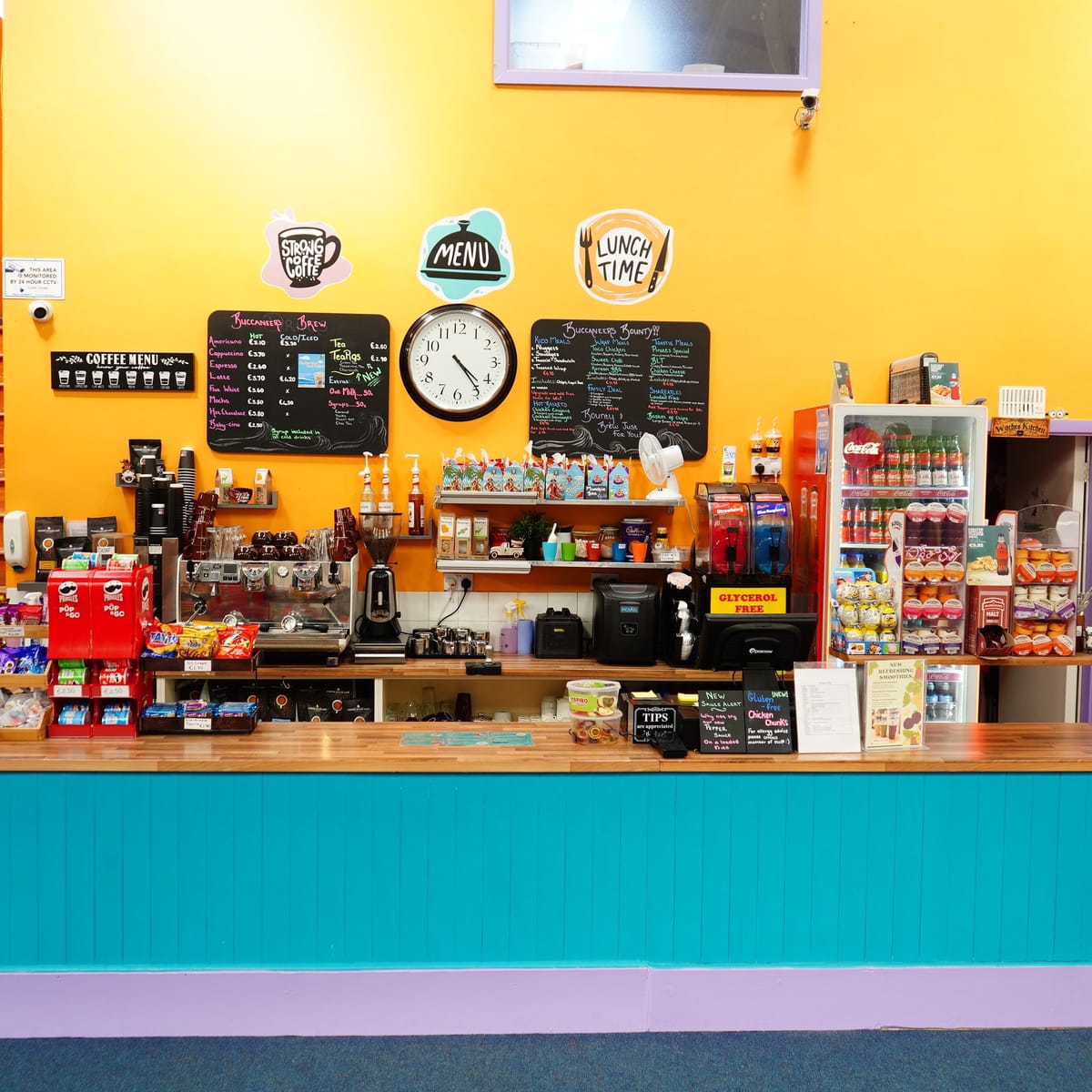 Wide view of the café counter facing the family seating.
