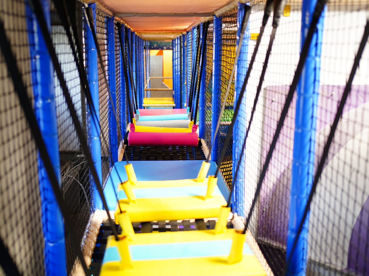 Padded hanging bridge obstacle inside Main Play.